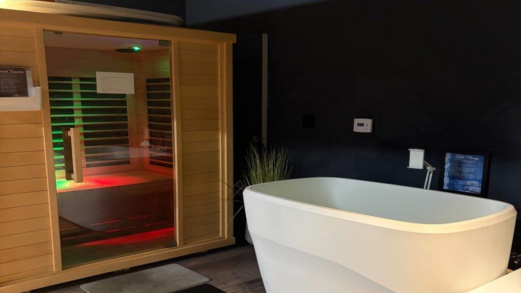 Infrared sauna and cold plunge side by side in the contrast therapy suite at Peak Fitness SLO