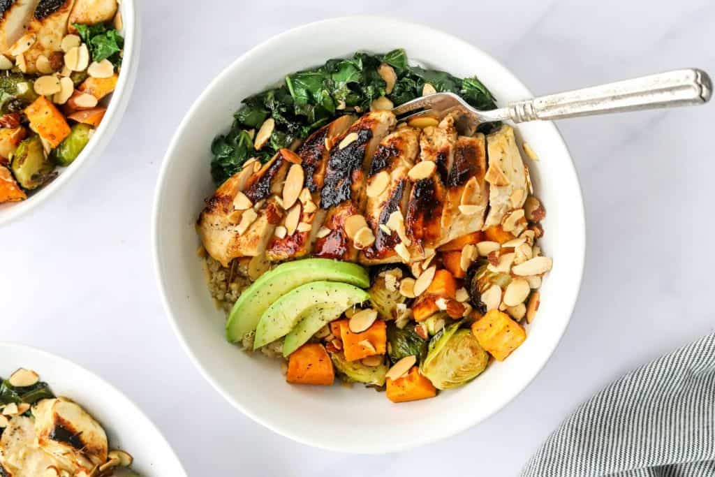 High-protein chicken and vegetable bowl representing practical nutrition targets for active adults