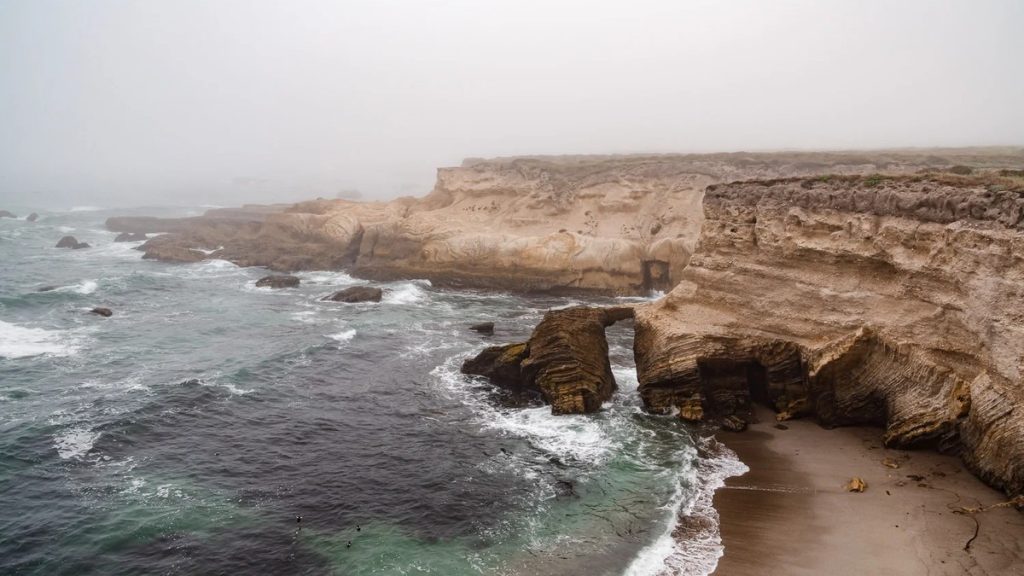 Dramatic coastal cliffs and rock arch along the Bluff Trail at Montana de Oro State Park near San Luis Obispo