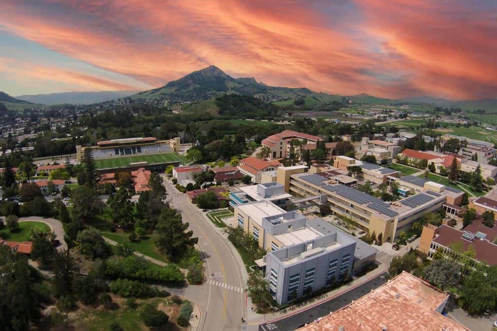 cal poly san luis obispo campus with bishop peak in the background during a beautiful sunset